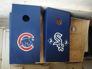 Bean bag toss board game boxes.